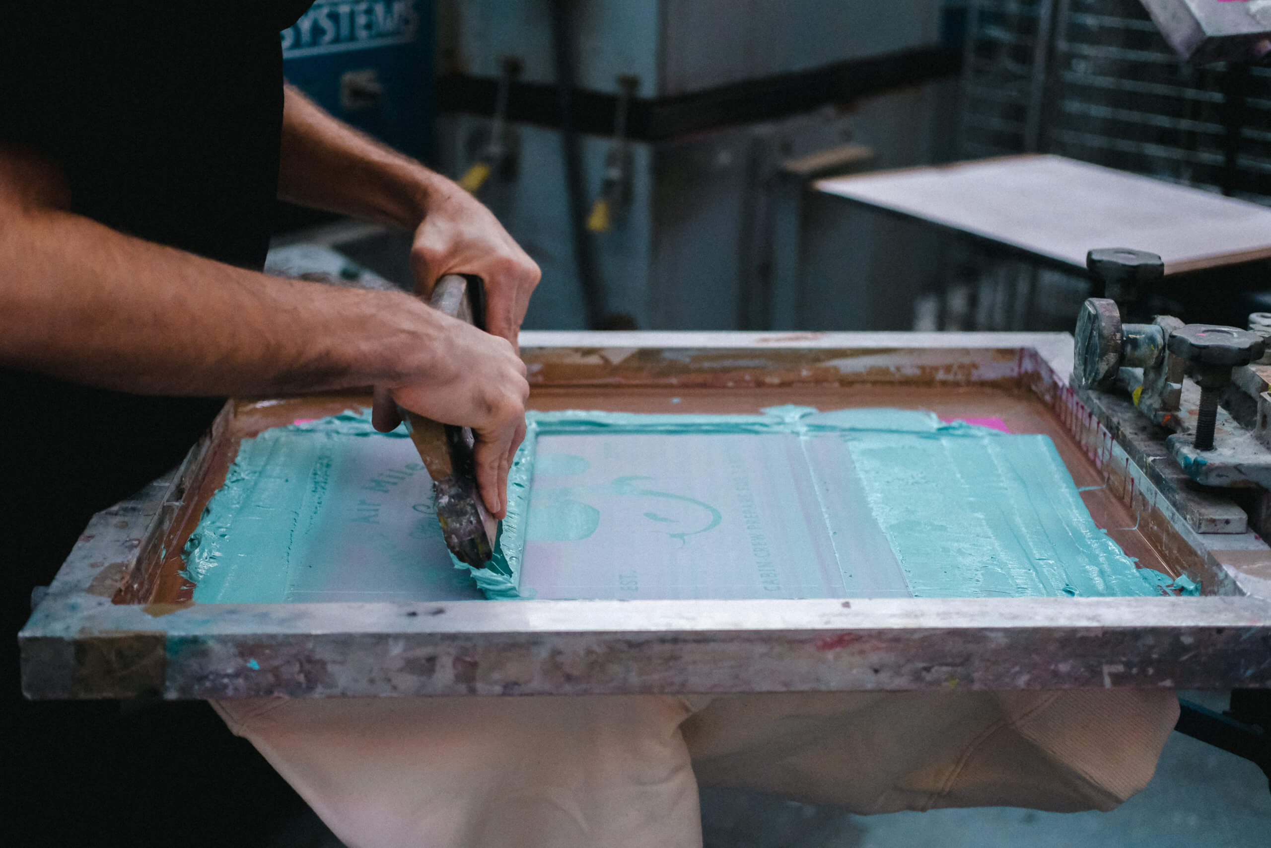 Maual screen printing in action