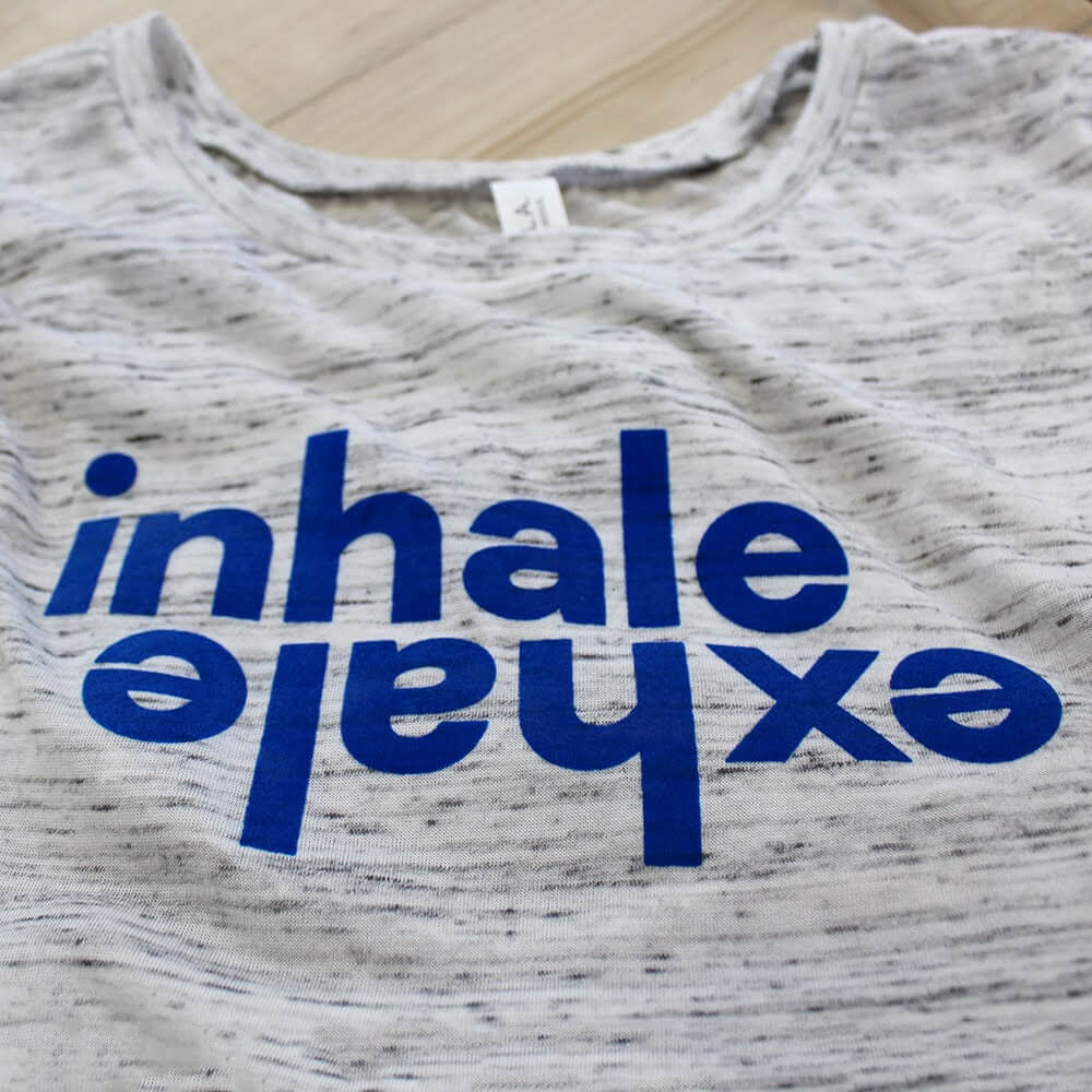 grey tshirt with blue text inhale/ehale