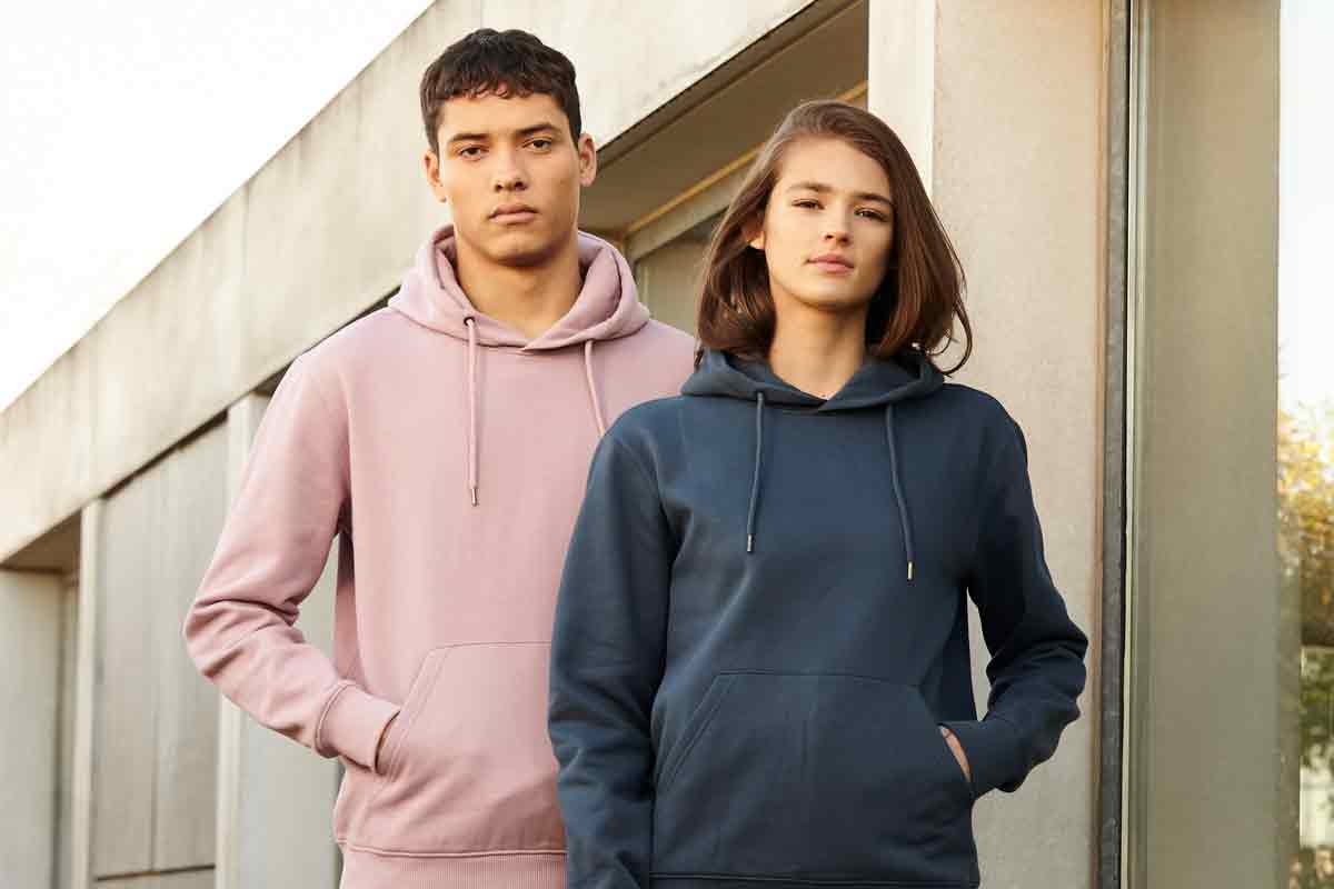 Diverse group wearing Continental hoodies, perfect for custom printing, showcasing sustainability and style.